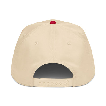 Beige cap with a red button on a white background
